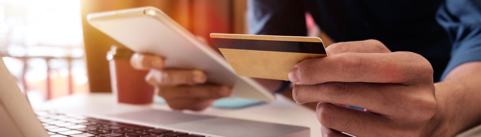 Man Using Mobile and Holding Credit Card